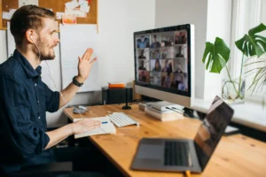 Young man having video conferencing call via computer.